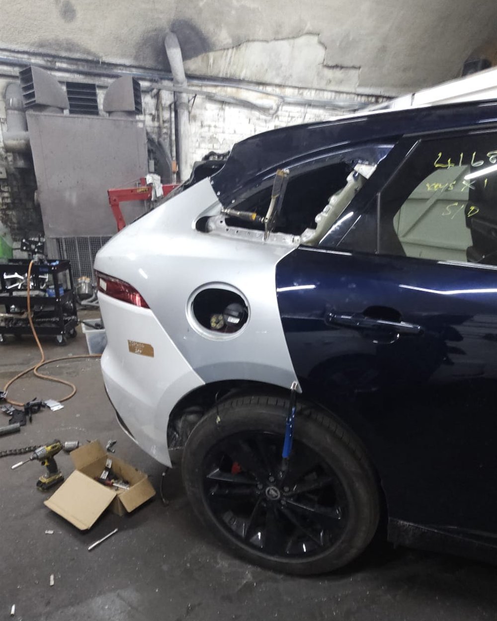 A car stripped down at the front for structural repair work