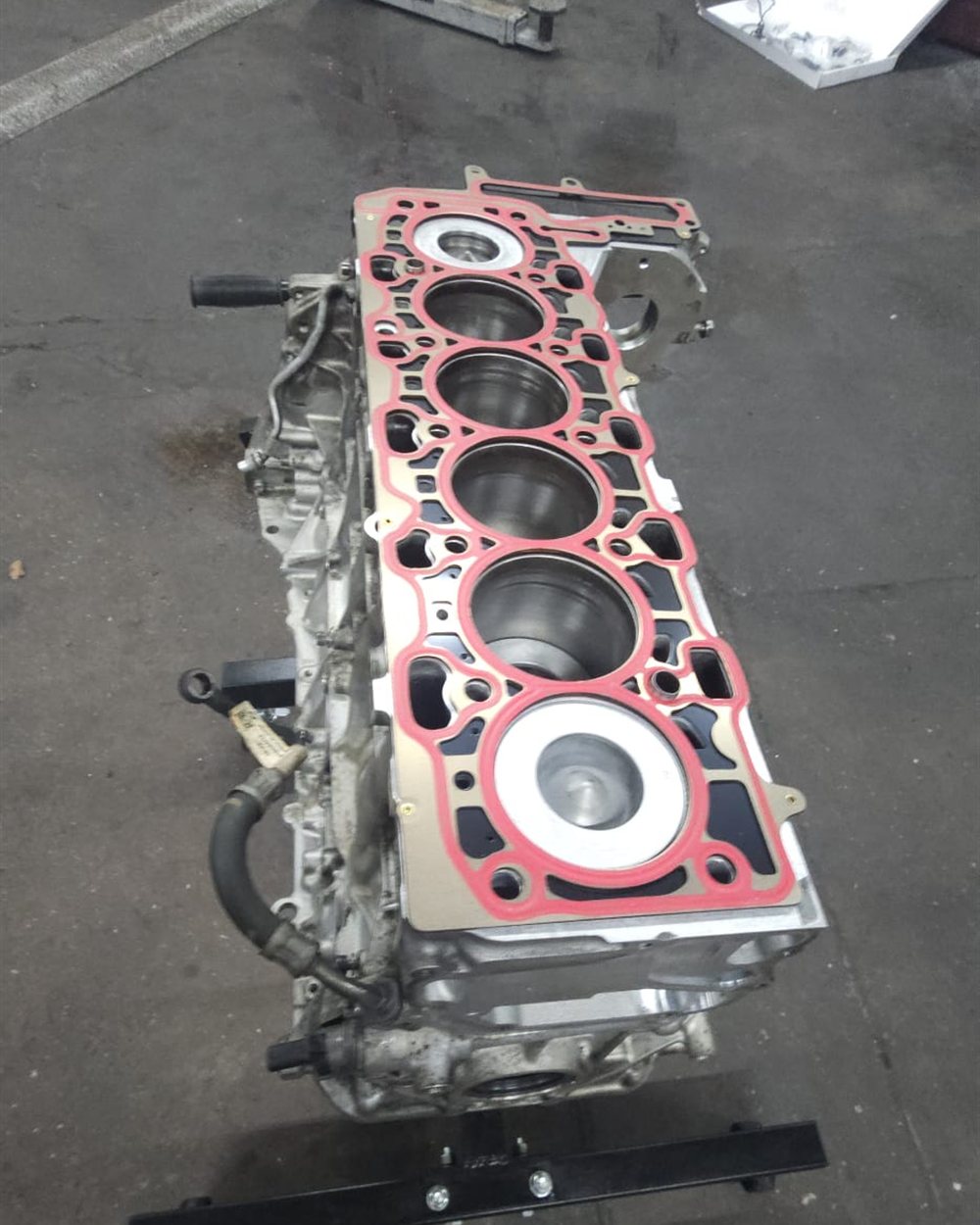 An engine stripped down on the bench during a rebuild