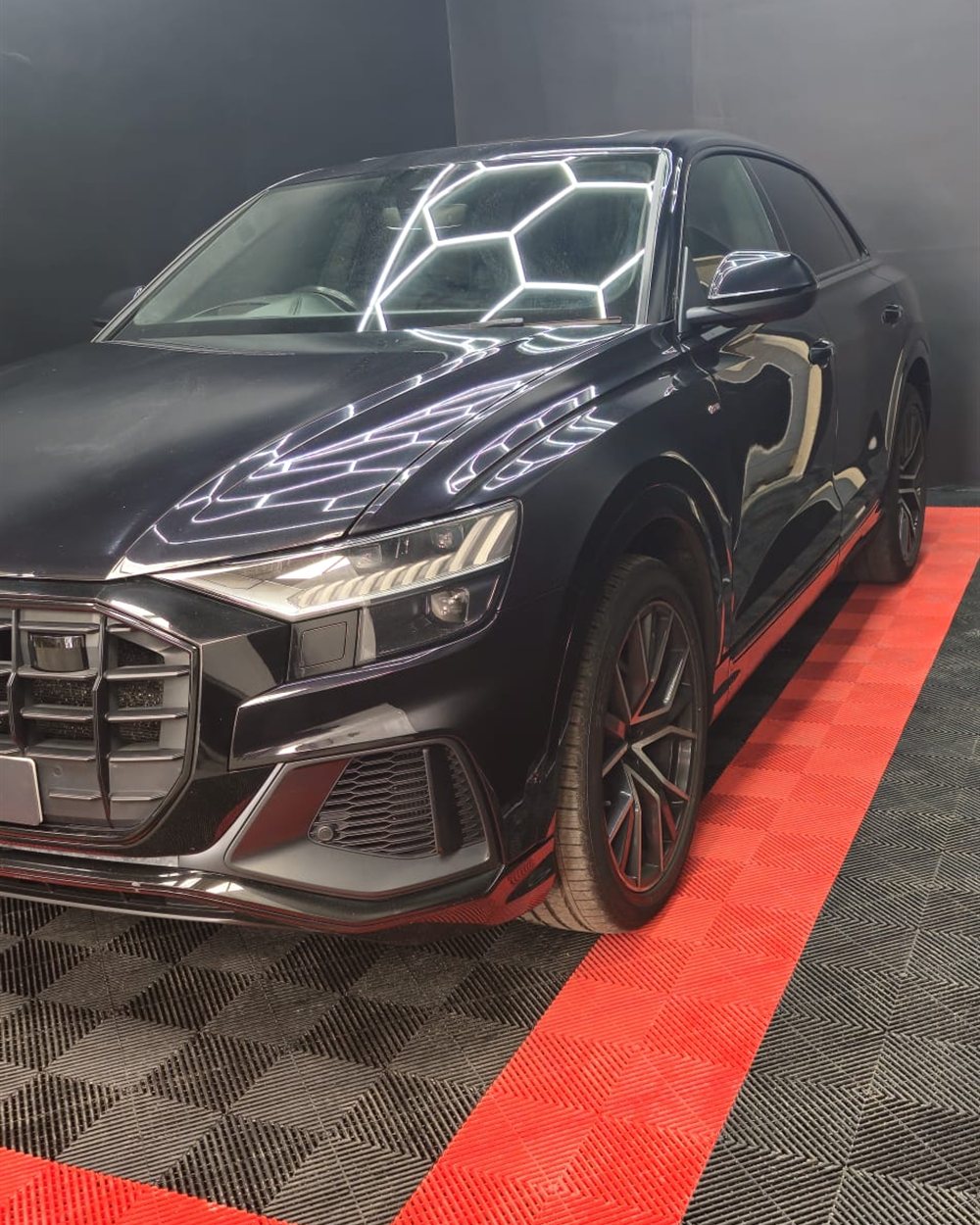 A finished car under the hexagon lighting