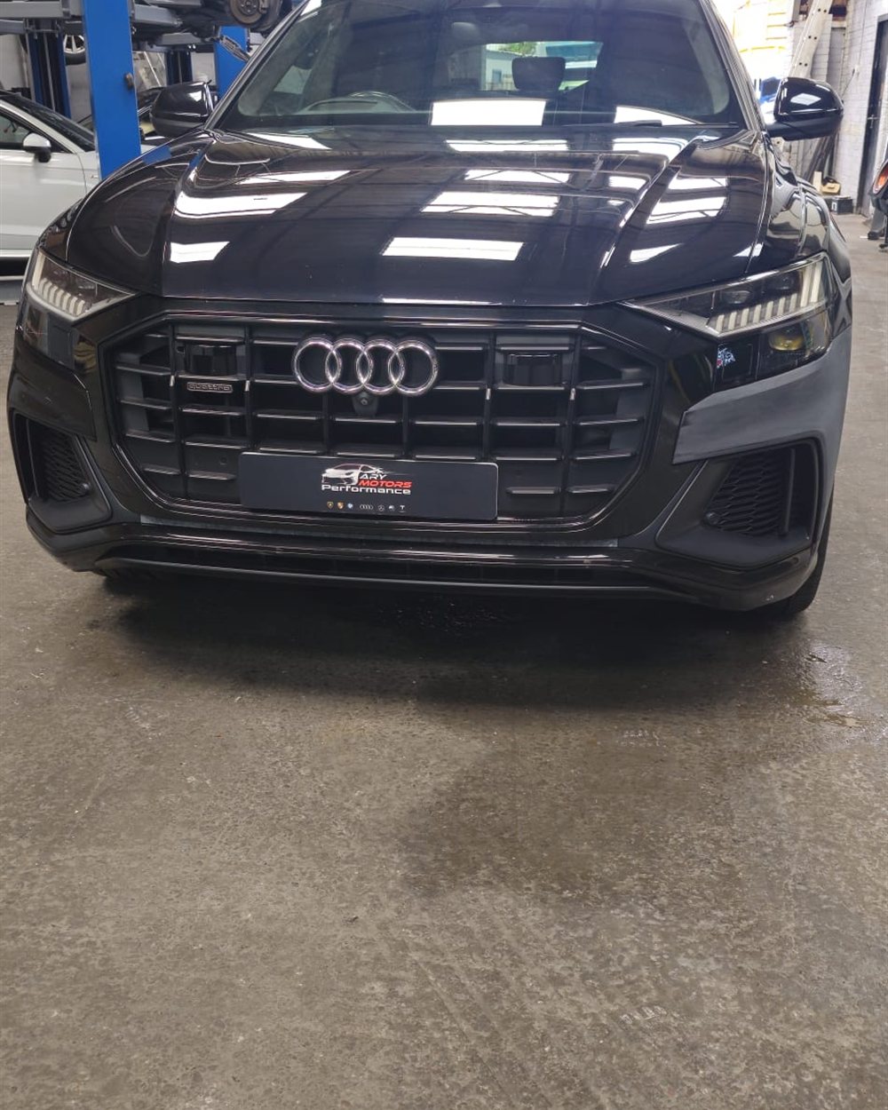 Working underneath a car on the two post lift