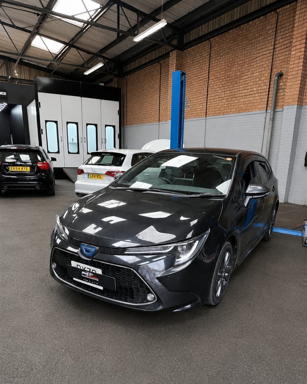 The workshop floor with vehicles booked in