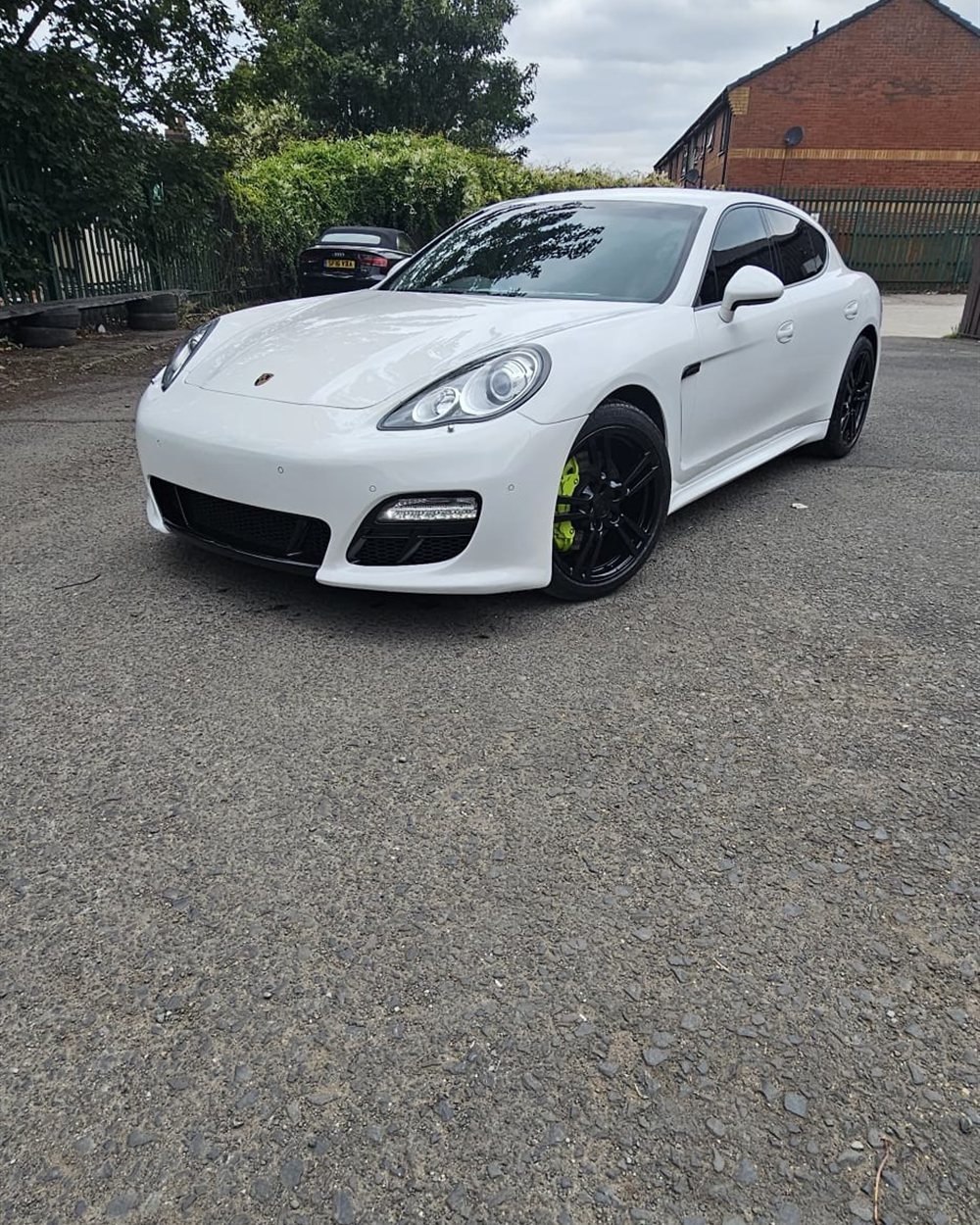 A vehicle parked outside the workshop